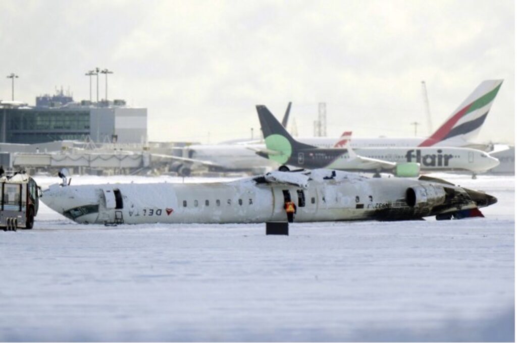 This picture shows a Delta Air Lines Flight 4819, a CRJ900 aircraft, that crashed and flipped upside down after landing at Toronto Pearson Airport on Tuesday, Feb. 18, 2025.